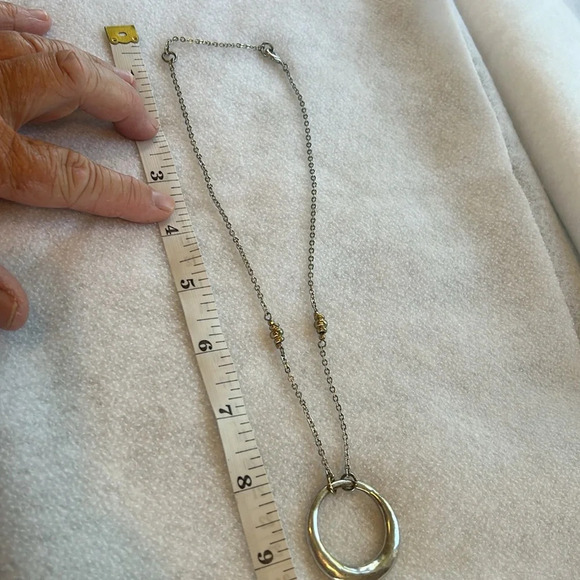 Silver and gold colored circle pendant necklace. Adjustable to 2 lengths. - Picture 5 of 6